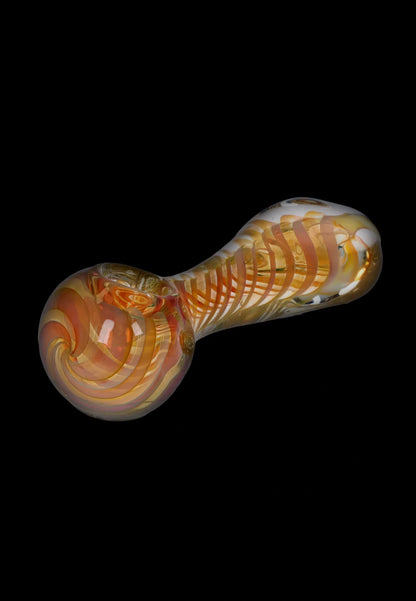 A side view of the 5-inch Gold Fume Twisty Spoon Pipe, featuring a swirling, colorful glass design.