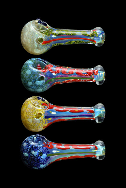 Four colorful glass smoking pipes stacked vertically against a black background.