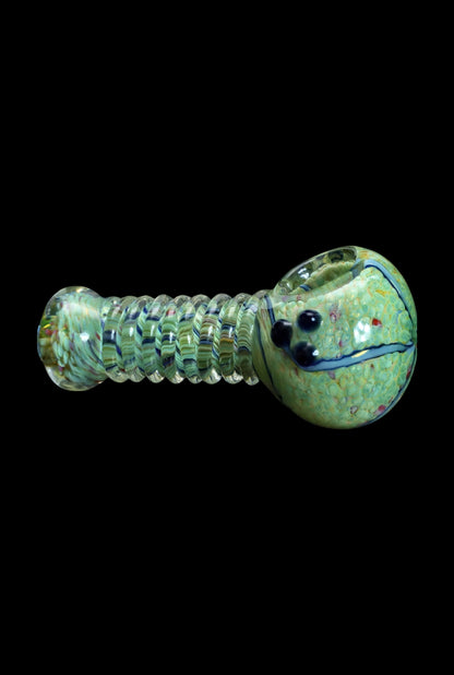 Green glass pipe with colorful swirling patterns and a sculpted face on the bowl.