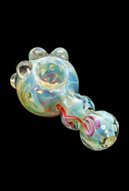 Hand-blown glass pipe with iridescent swirls and red accents.