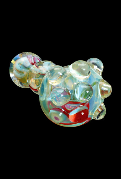 Hand-blown glass cannabis water pipe with colorful swirls.