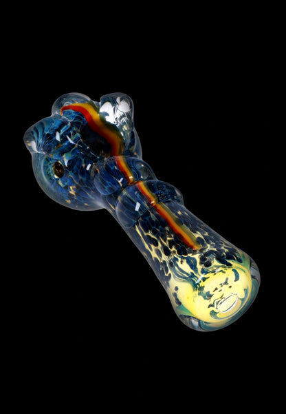 A detailed close-up of the Fancy Stem Spoon Pipe - 4.5 in., showing colorful glass swirls and a curved design.