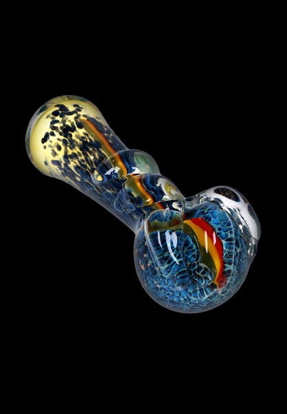 A side view of the 4.5-inch Fancy Stem Spoon Pipe, showcasing its colorful glass swirl design.