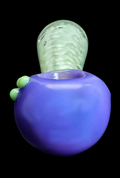 Purple and green glass bubbler for smoking cannabis.