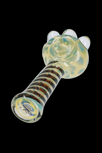 Front view of the Dicro Spoon Pipe - 4.5 in., showing its colorful glass design against a dark background.
