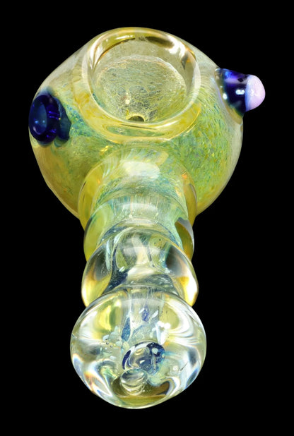 Green glass pipe with blue accents, studio shot.