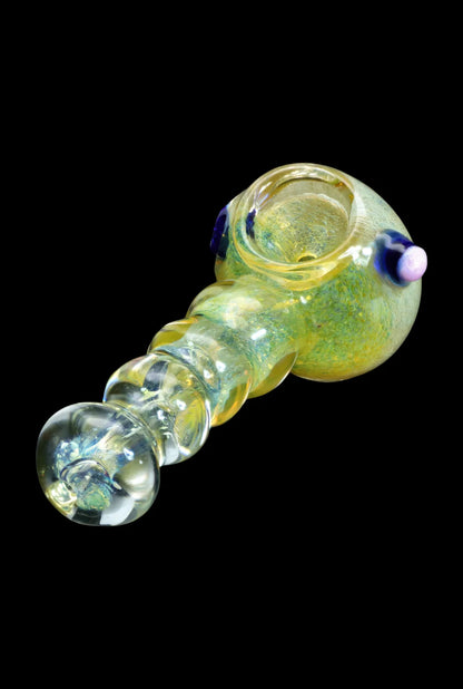 Hand pipe with swirling green and yellow glass, featuring decorative bulbous accents.