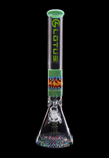 Green and colorful glass bong with intricate design and water filtration system.