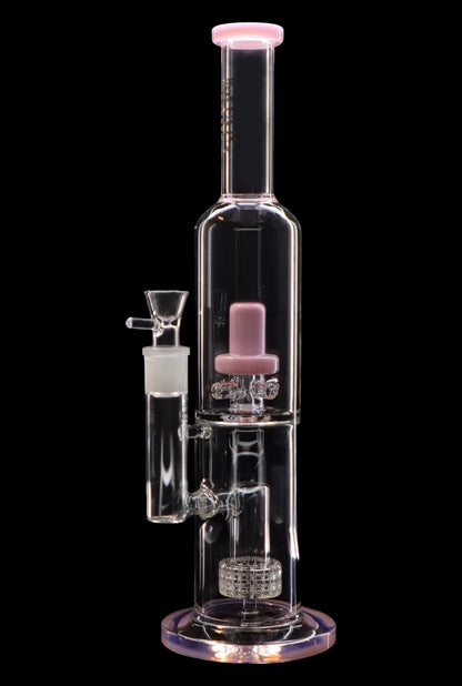 Pink glass water pipe (bong) with intricate percolators, isolated on a black background.
