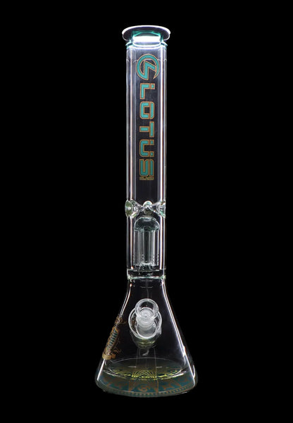 Clear glass bong with intricate design and green accents, isolated on a black background.
