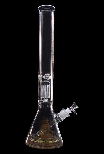 Clear glass bong with intricate etched design and diffusion perc, isolated on a black background.