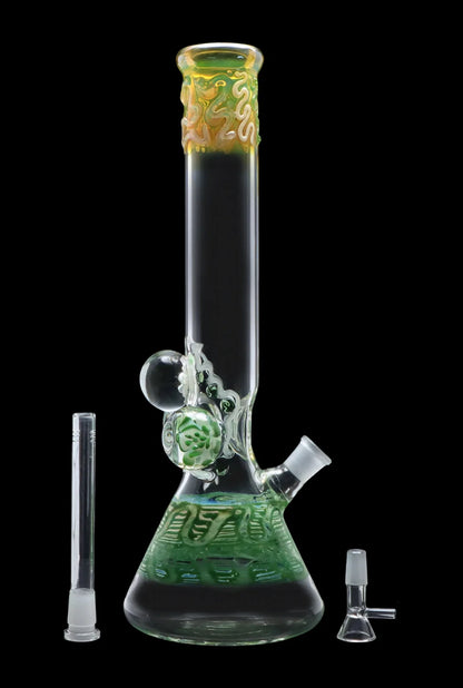 Studio-style front view of the Smoke Cartel Mushroom Marble Water Pipe - 18 in., showing its tall clear tube, green patterned beaker base and decorative marble on a black background