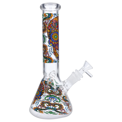Angled studio shot of the Smoke Cartel Skull Beaker Bong - 10 in. showing the clear glass beaker and colorful skull mandala decal up the neck.