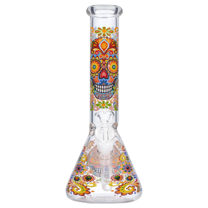 Front view of the Smoke Cartel Skull Beaker Bong - 10 in. showing a colorful sugar-skull floral pattern along the straight neck and beaker base.