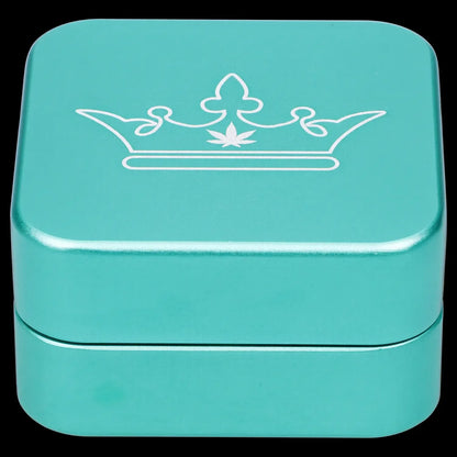 Turquoise metal storage box with a white crown and cannabis leaf design.