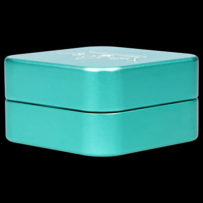 A top-down view of the 55mm Queen of Bud 2-Piece Grinder, showcasing its metallic, multi-tiered design against a black background.