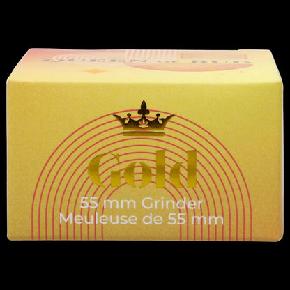 Yellow box for a “Gold” 55mm cannabis grinder, with red radial lines and French text.