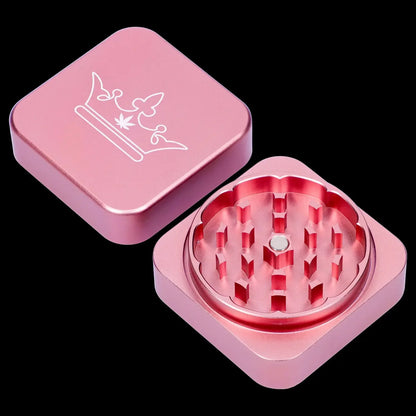 A top-down view of the open 55mm Queen of Bud 2-Piece Grinder displaying its metal grinding teeth against a black background.