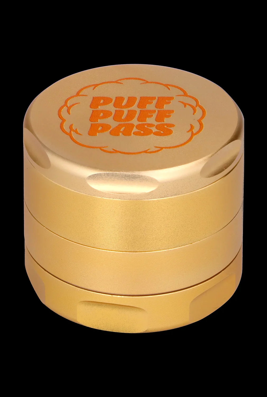 Gold cannabis grinder with “PUFF PUFF PASS” engraved on the lid.
