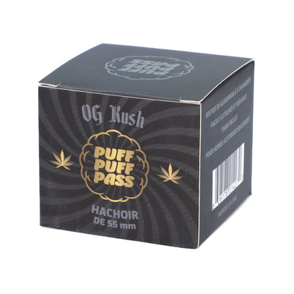 A square, black and yellow box labeled "OG Kush" and featuring cannabis leaf graphics, advertising a 55mm grinder.