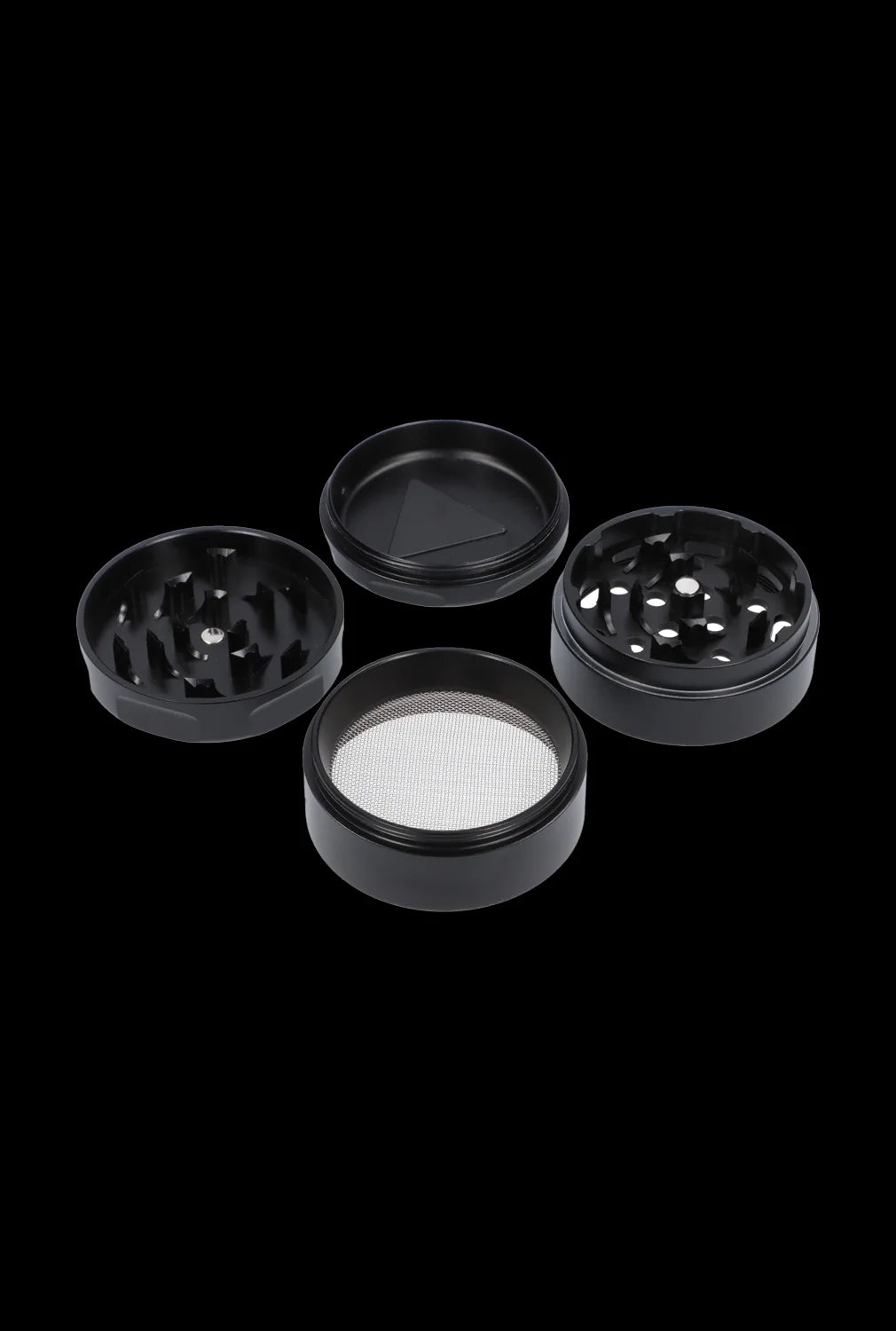Black four-piece cannabis grinder with disassembled parts on a dark background.