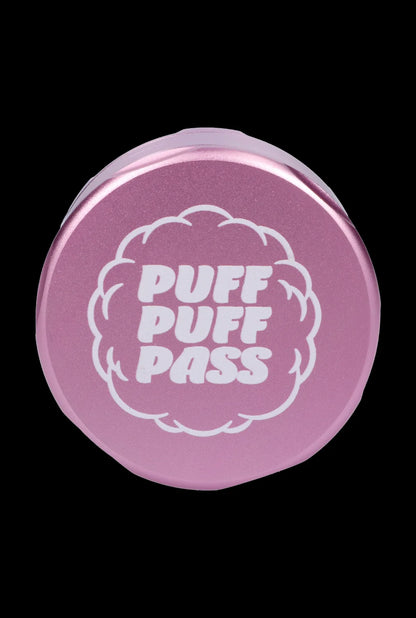 Pink metal grinder with “PUFF PUFF PASS” text.