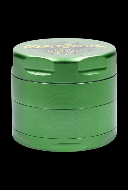 Green four-piece cannabis grinder with branded text.
