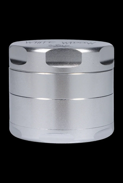 Silver four-piece cannabis grinder.