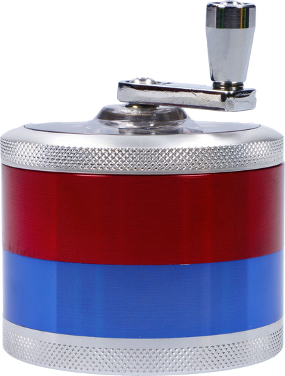 Close-up side view of the CNC Aluminum Grinder-Assorted (OEM Colors)-62mm showing its red and blue anodized body, knurled silver top edge, and chrome crank handle.
