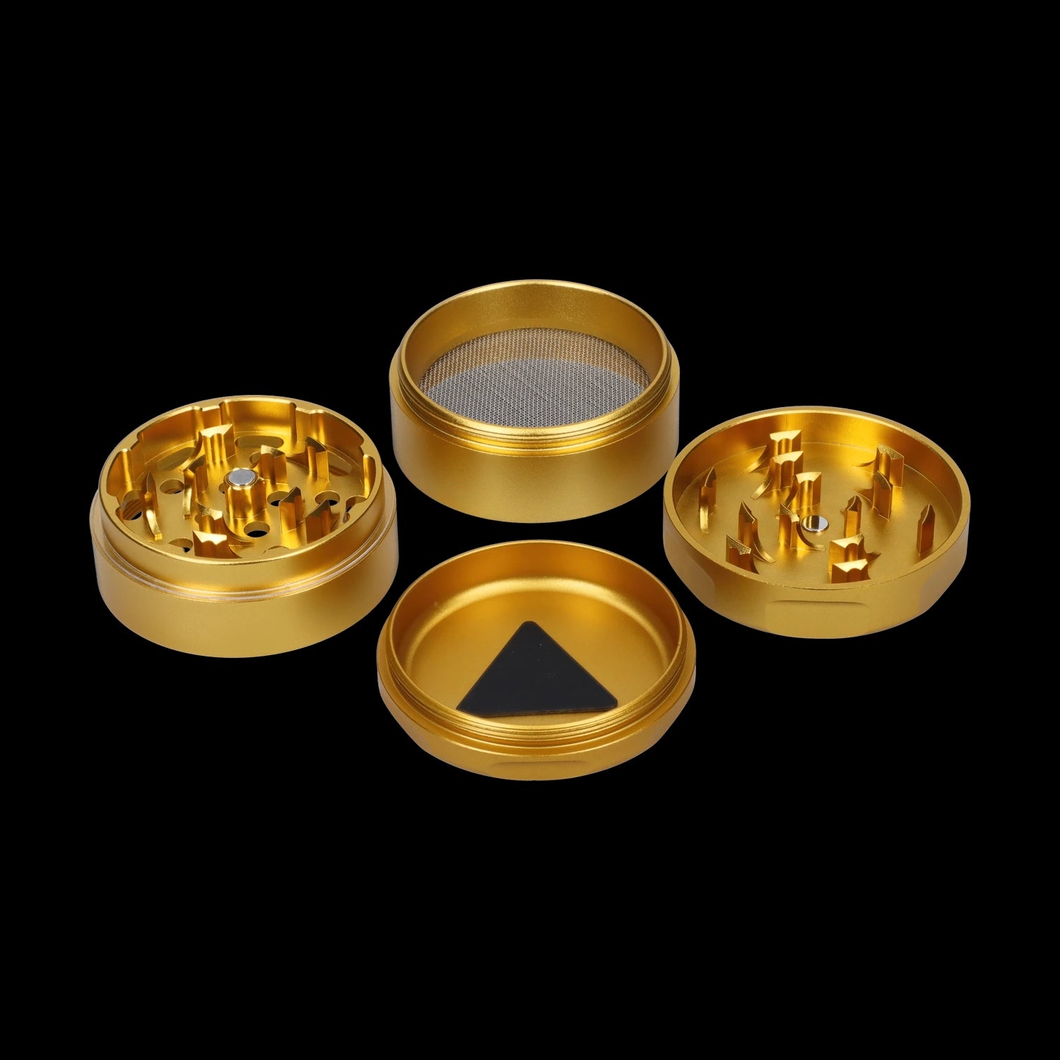Top-down view of the opened Famous Design-Surrender Aluminum 3 Stage Grinder-Gold showing four gold anodized sections with teeth, a mesh screen, and a triangular magnet.