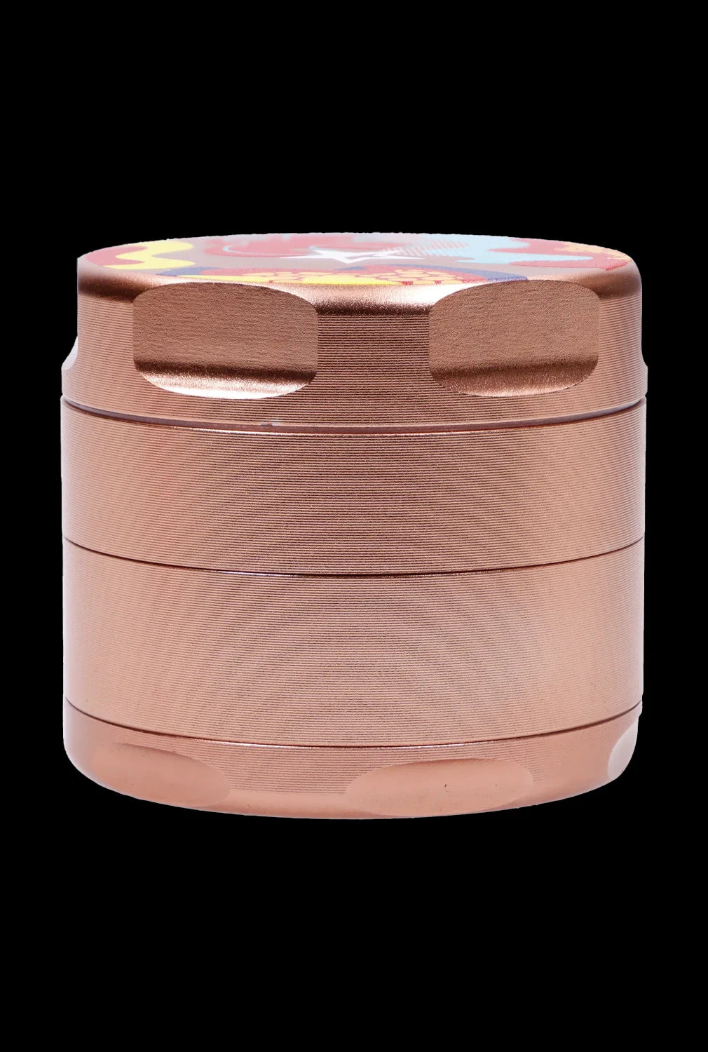 Close-up front view of the rose gold Famous Design-Papaya Aluminum 3 Stage Grinder-Rose Gold showing stacked textured chambers and a colorful patterned lid against a black background