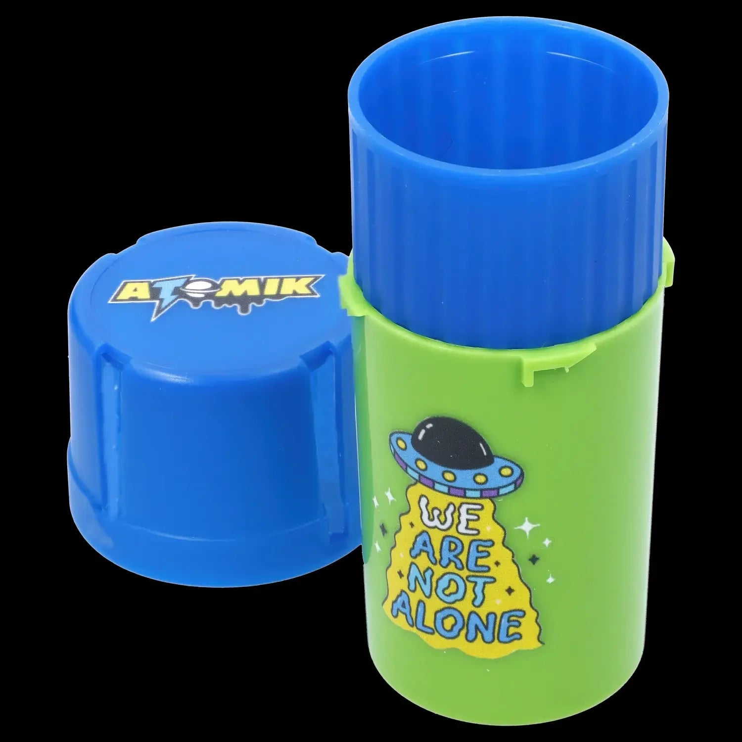 Bright green and blue cannabis container with alien-themed graphics and the text “We Are Not Alone.”