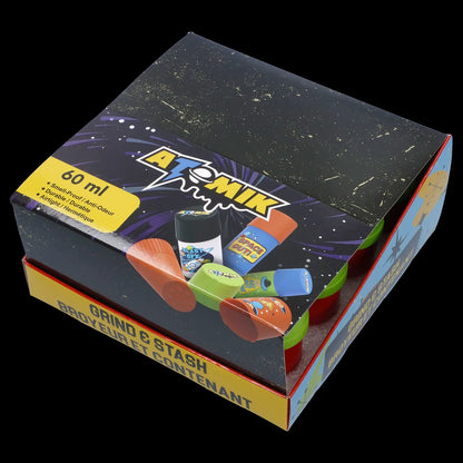 A colorful, patterned box labeled “Atomik” and “Grind & Stash” containing various small, brightly colored containers and a grinder, likely for cannabis storage and preparation.