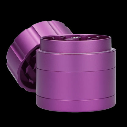 Purple four-piece cannabis grinder with lid partially removed.