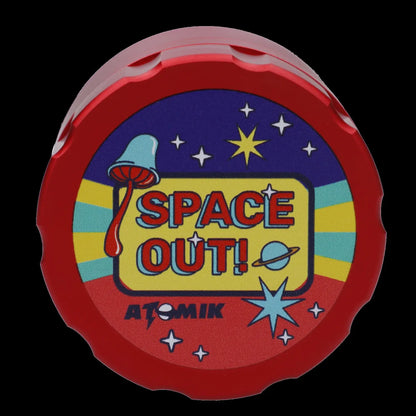 Red, circular container with a retro space-themed design reading "SPACE OUT!" and "ATOMIK".