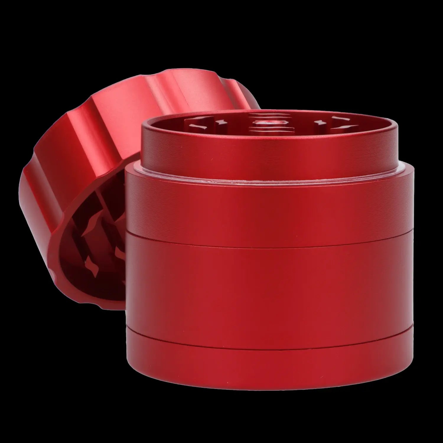 Red four-chamber cannabis grinder with lid partially detached.