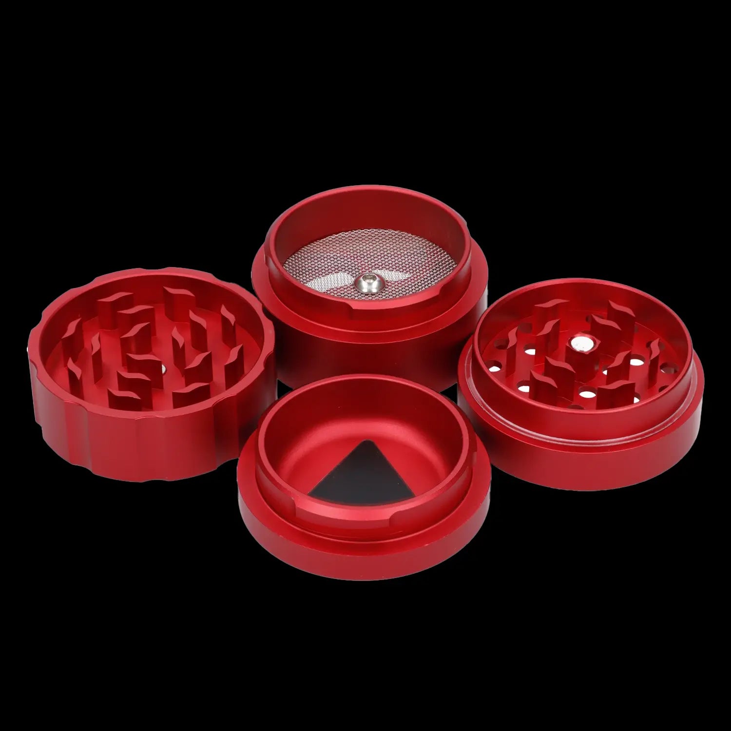 Red four-piece cannabis grinder disassembled on a black background.
