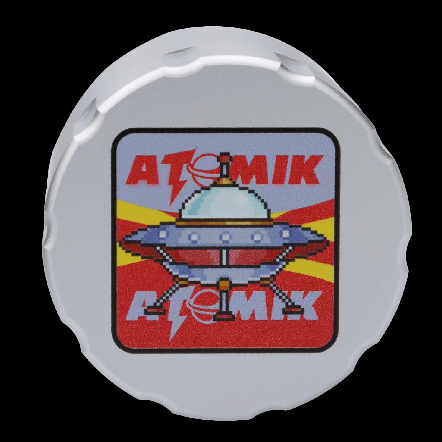 White cannabis accessory lid featuring a pixelated UFO design with "ATOMIK" text.