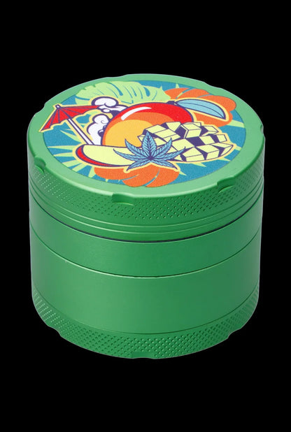 Close-up angled view of the Cabana Cannabis Co. 3-Stage Grinder Parasol Green showing its stacked green chambers and colorful tropical lid art.