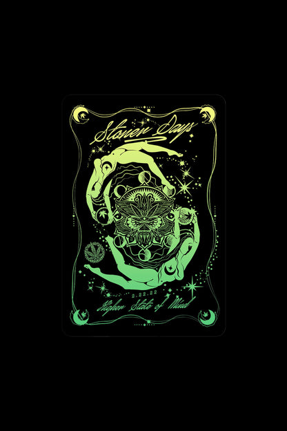 Glowing green tarot card design featuring hands cradling a cannabis leaf within a celestial, ornate frame, with the text “Seven Days” and “Higher State of Mind” above and below.