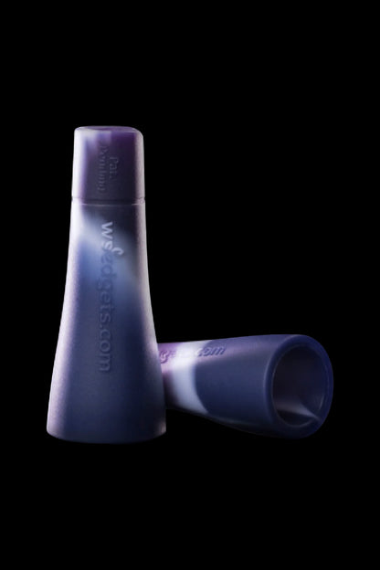 Purple silicone cannabis pipe screens against a black background.