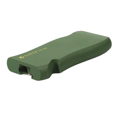 Angled close-up of the green RYOT Super Slim Magnetic Dugout With One Hitter showing its matte finish, gold "SUPER SLIM" logo, and rounded rectangular shape.