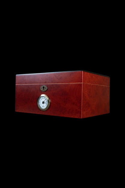 Red wooden storage box with a lock and humidity gauge, likely for cannabis preservation.