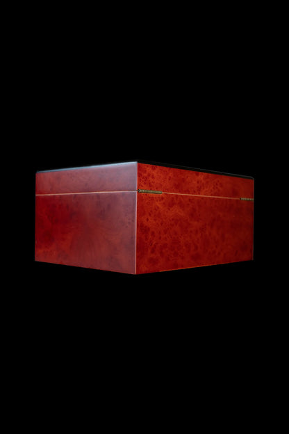 Red wooden storage box, possibly for cannabis accessories, against a black background.