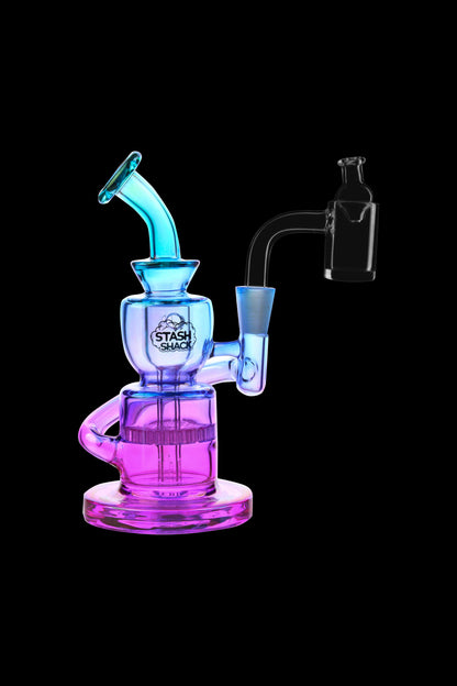A colorful glass rig with a bubbler and quartz nail, branded "Stash Shack."
