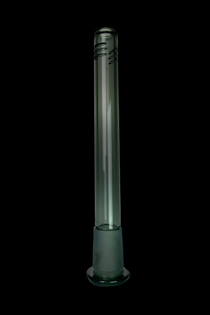 Green glass bong against a black background.