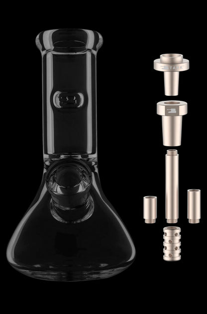 Black glass bong with disassembled gold-toned downstem and diffuser components beside it.