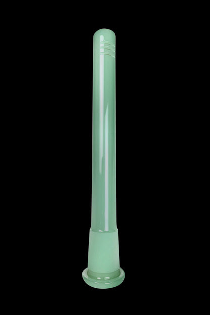 Green glass bong isolated on a black background.