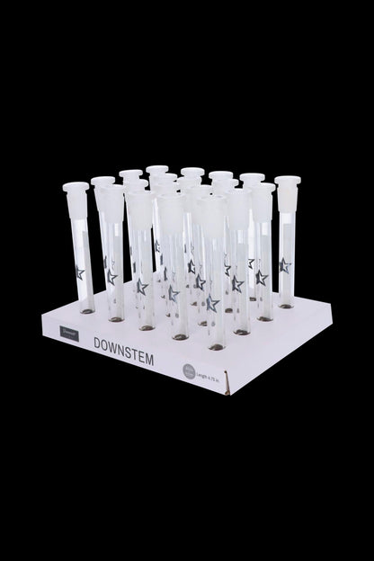 Clear glass downstems with star detailing arranged on a white display stand, labeled "DOWNSTEM."