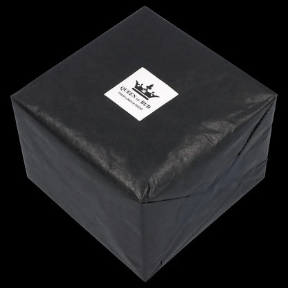Black gift box with “Queen of Bud” logo, suggesting cannabis accessories inside.